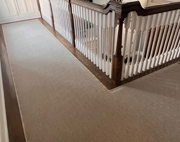 Light brown carpet runner in Madison hallway